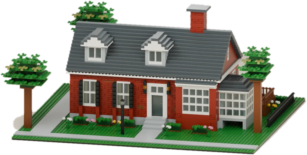 Detailed brick model of our Louisville test house with red brick walls, dormer windows, a sunroom and leafy trees